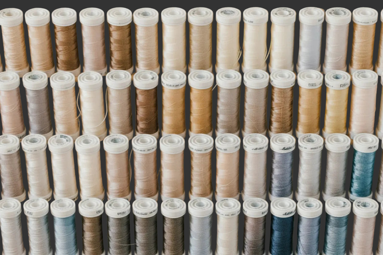 thread-spools-stacked-on-a-shelf